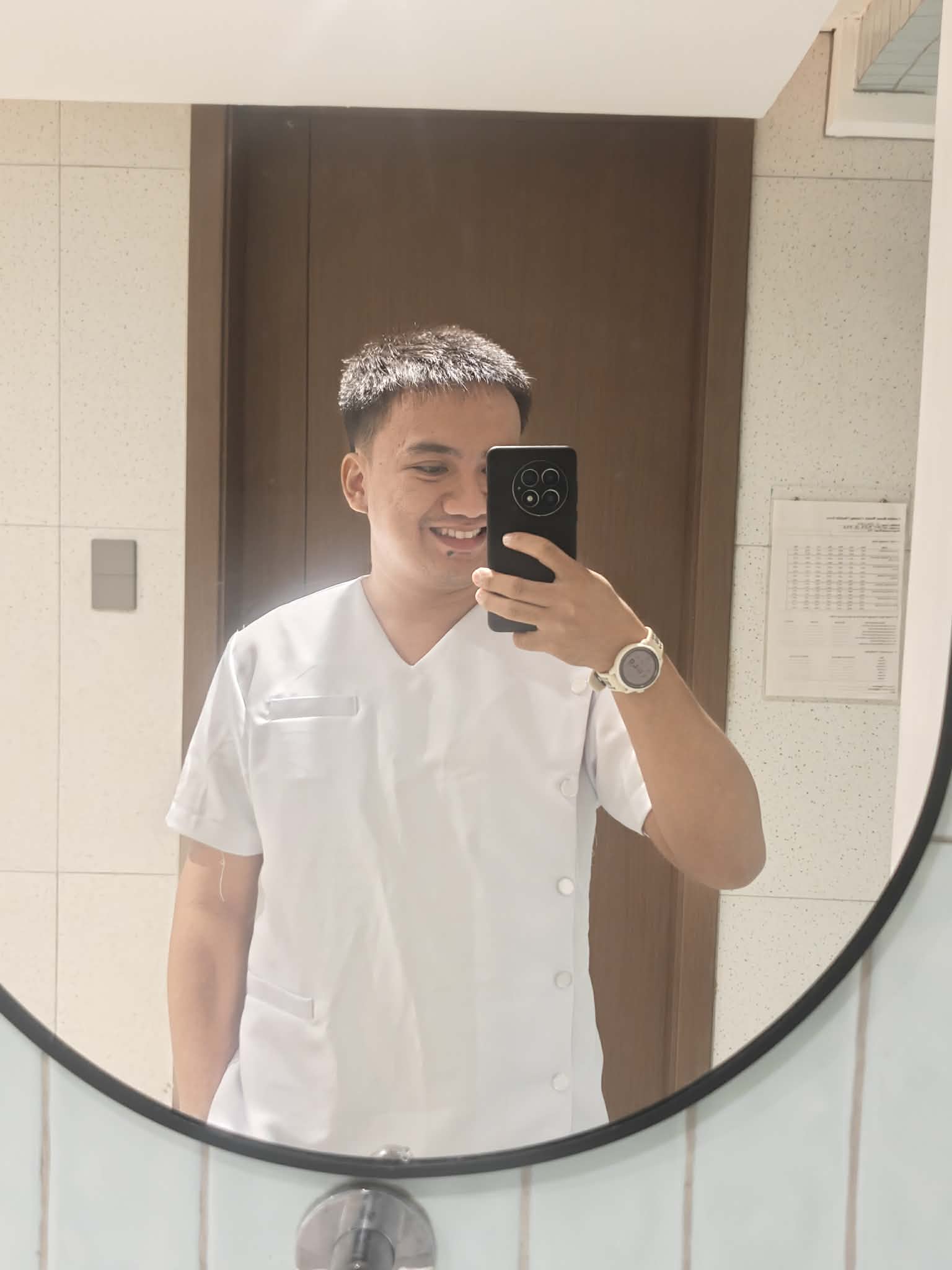 Franz wearing a white medical uniform